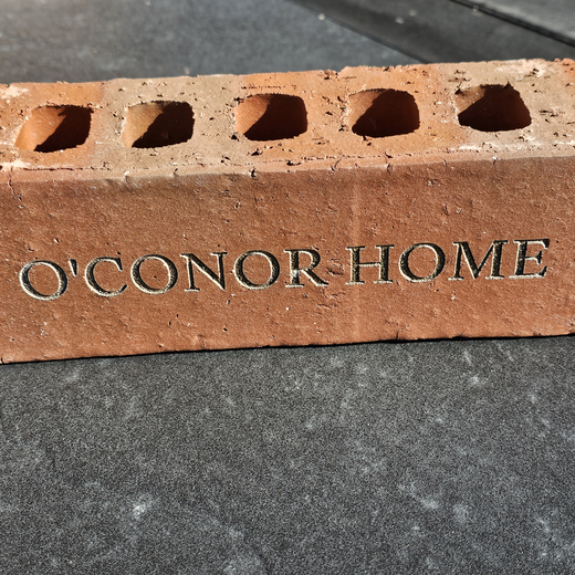 An engraved O'Conor Home brick